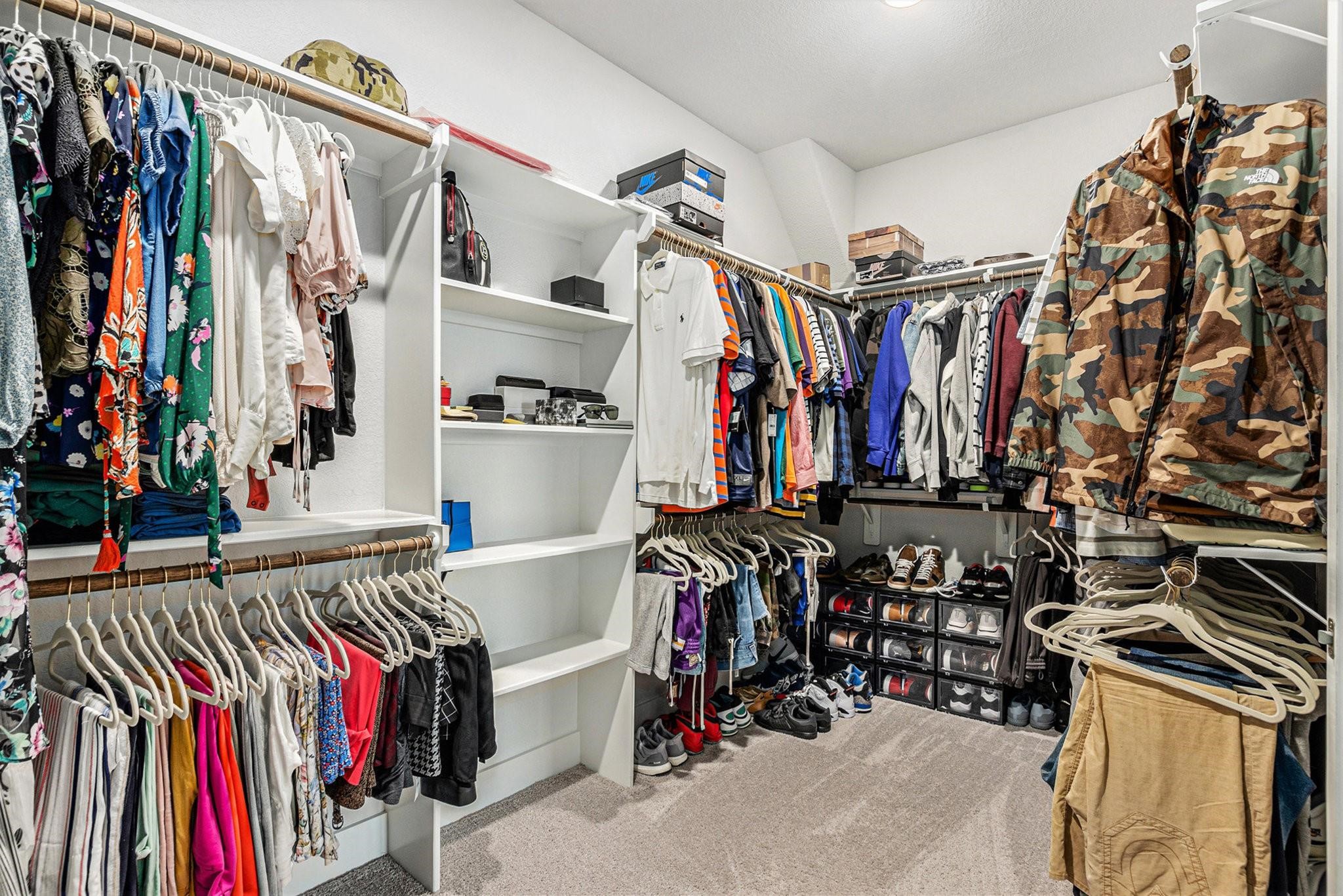 1818 Homewood Point Lane Rosharon, TX 77583 - Photo 23 of 41 a view of walk in closet with clothes and shoes