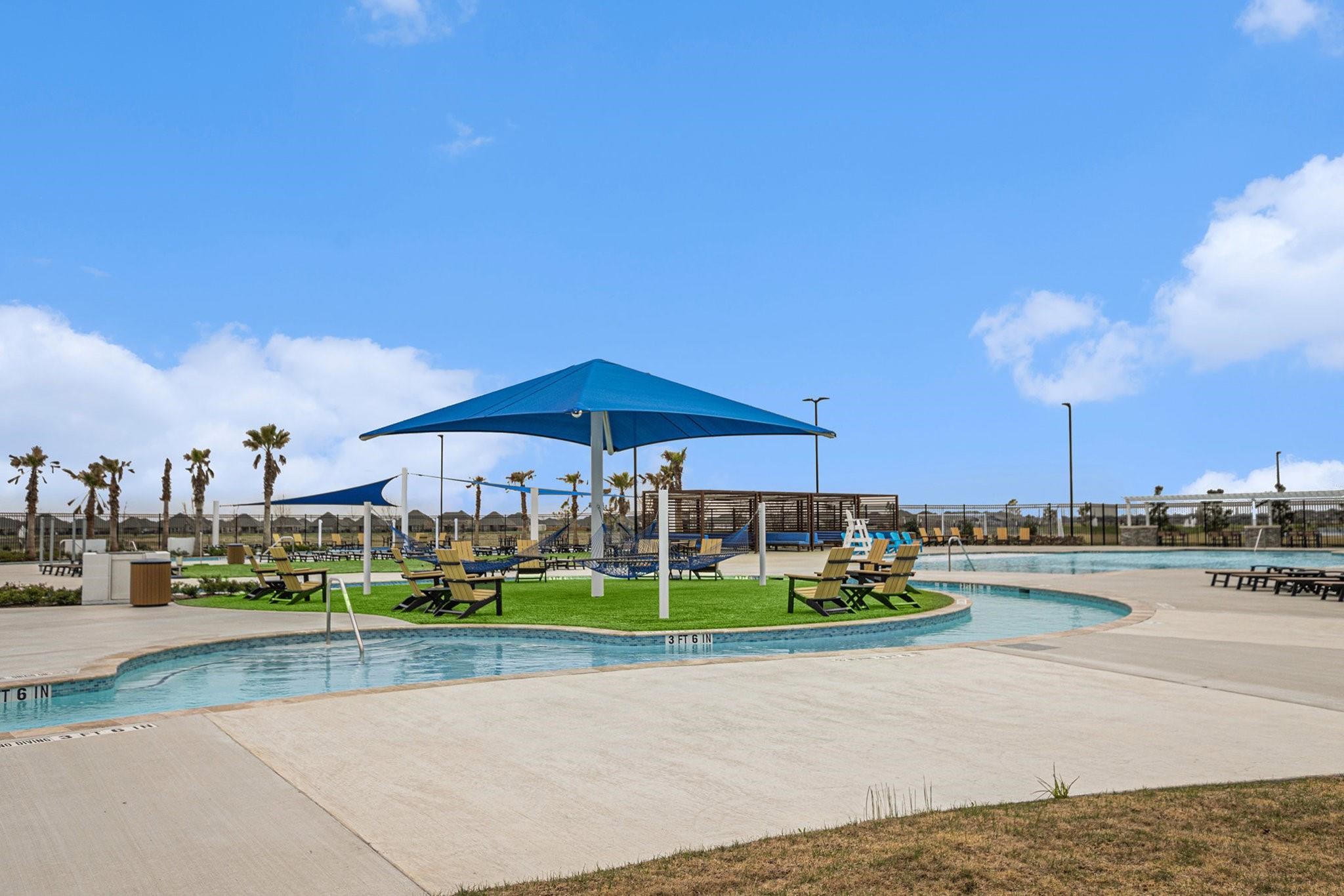 1818 Homewood Point Lane Rosharon, TX 77583 - Photo 40 of 41 a view of a tennis ground with a table and chairs under an umbrella