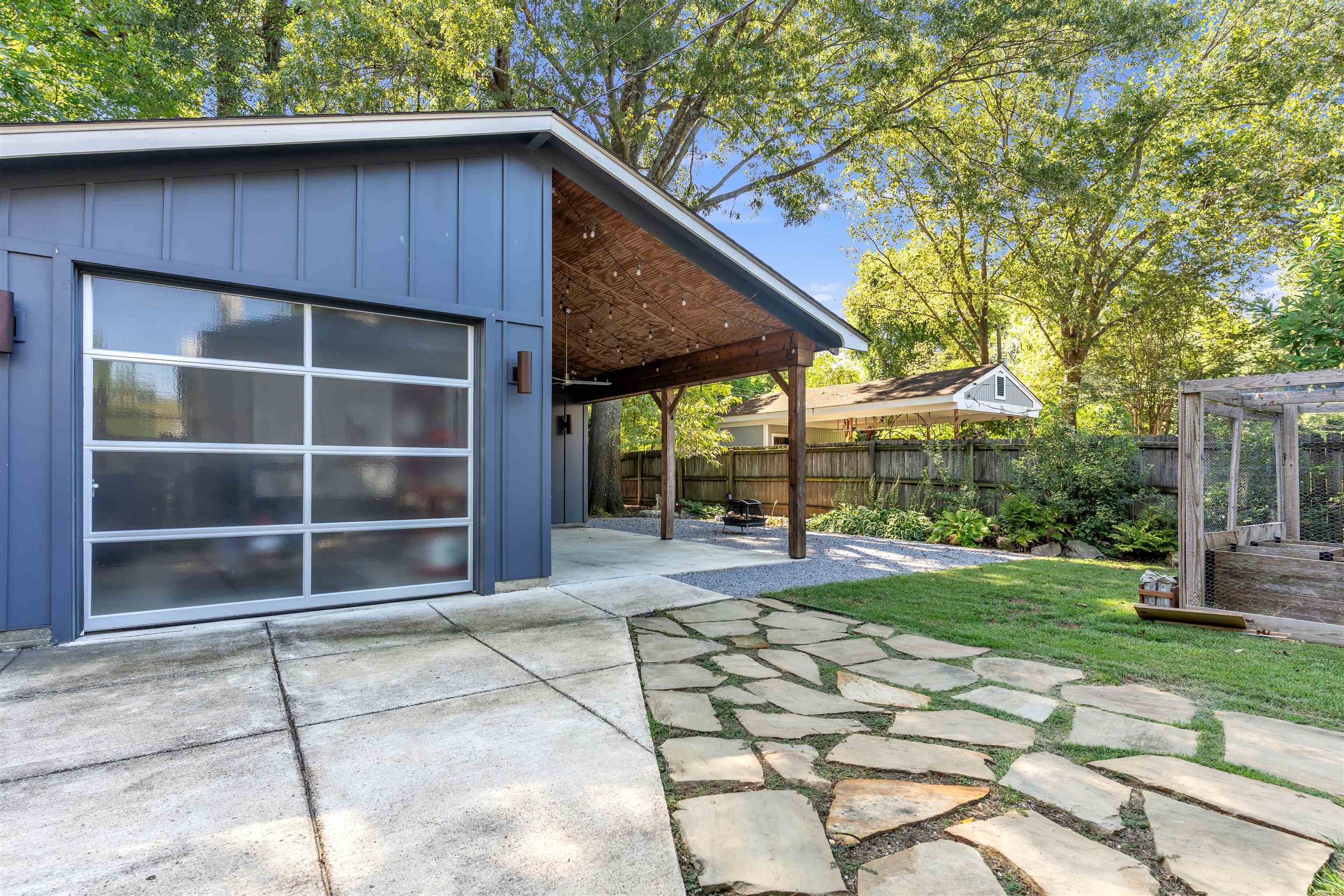 1757 Carruthers Place Memphis, TN 38112 - Photo 26 of 40 a view of a house with a yard and sitting area