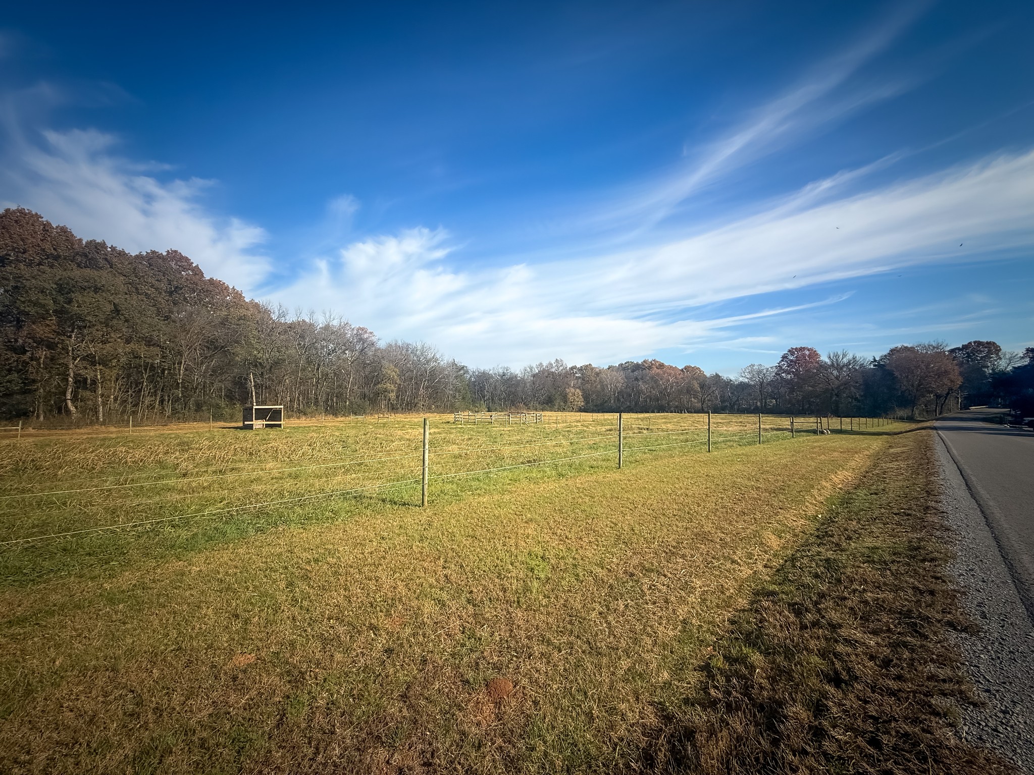 a view of lake with green field