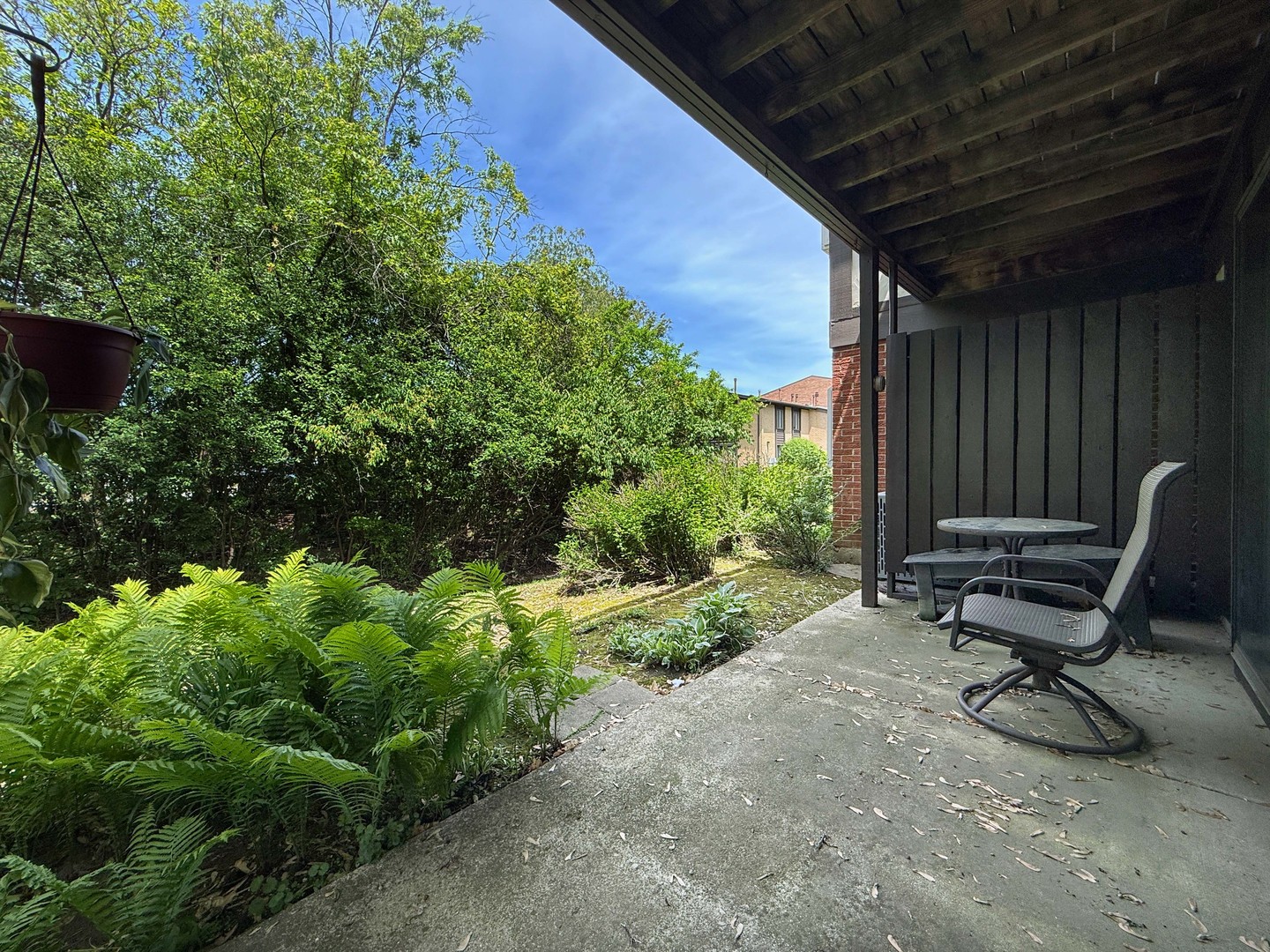 258 Brookside Lane, Unit B Willowbrook, IL 60527 - Photo 17 of 21 a view of a backyard with chairs and a grill