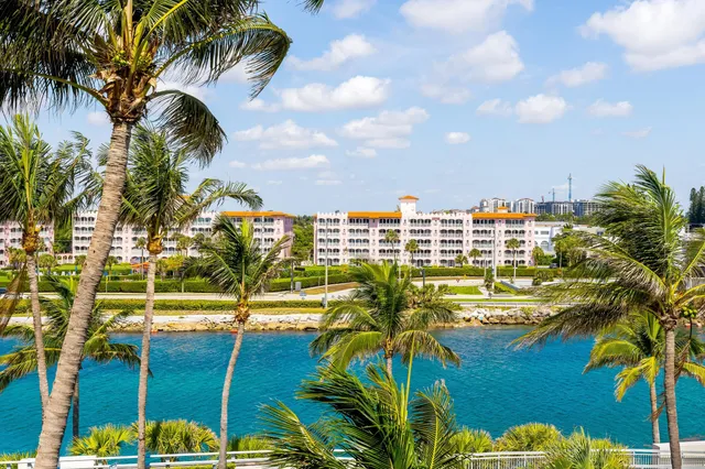 a bathroom with a granite countertop sink a mirror and a bathtub
