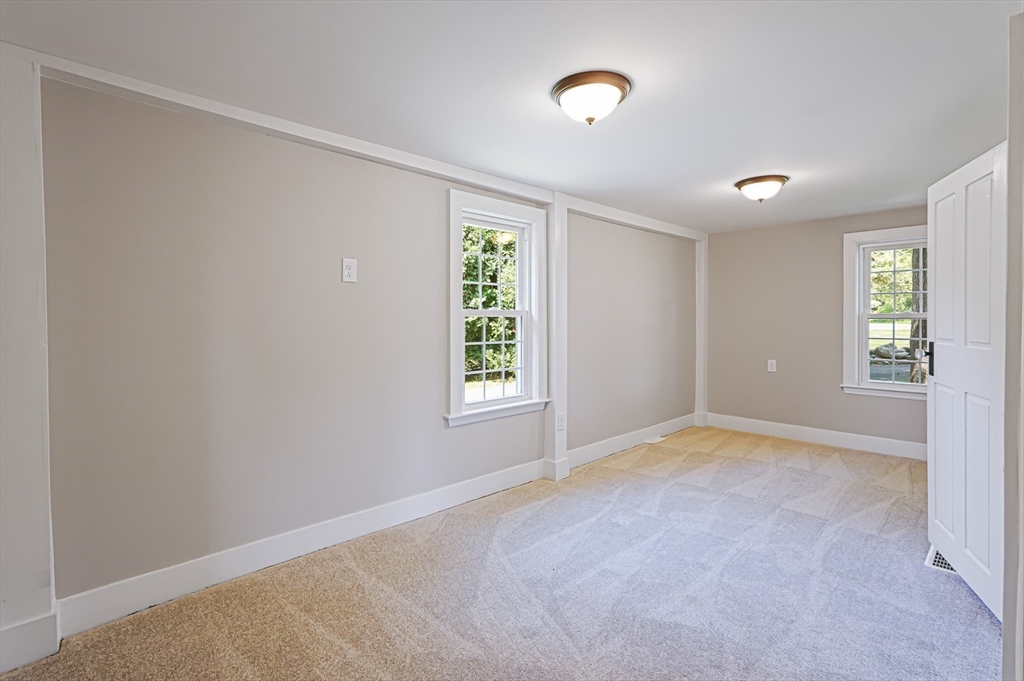 11 Millville Road Mendon, MA 01756 - Photo 12 of 28 an empty room with windows