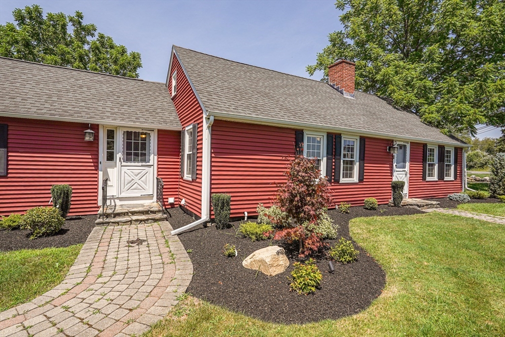 11 Millville Road Mendon, MA 01756 - Photo 21 of 28 a front view of a house with garden