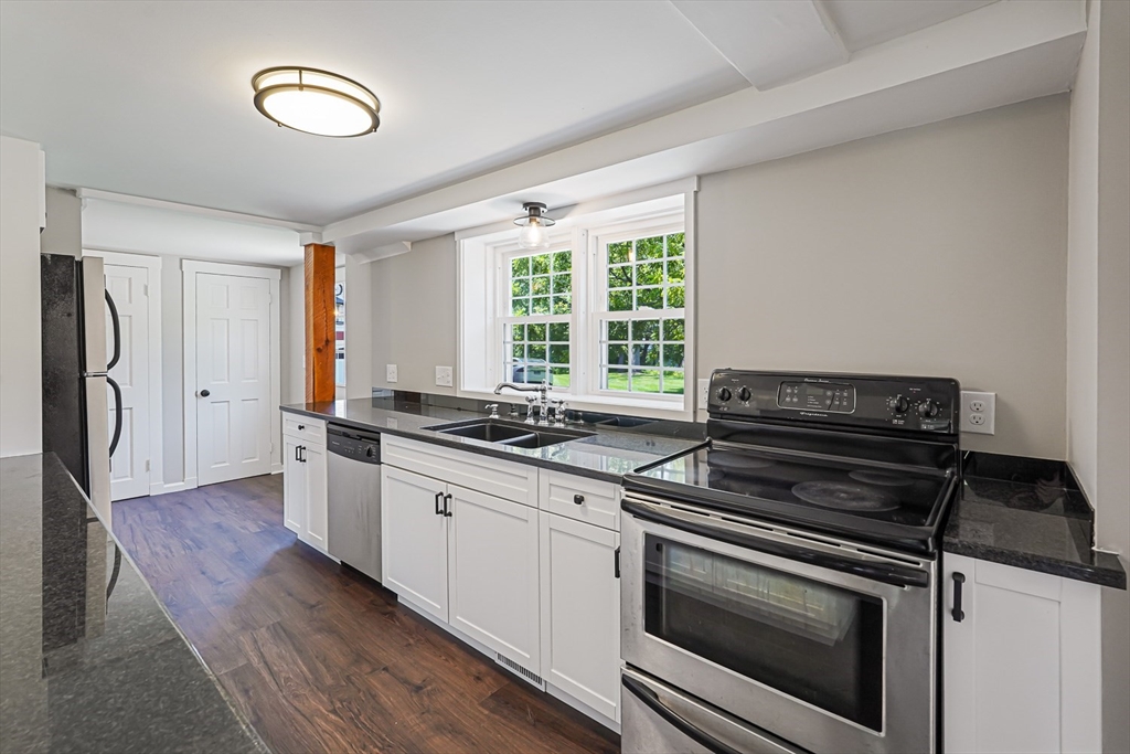 11 Millville Road Mendon, MA 01756 - Photo 6 of 28 a kitchen with stainless steel appliances a stove a sink and a refrigerator