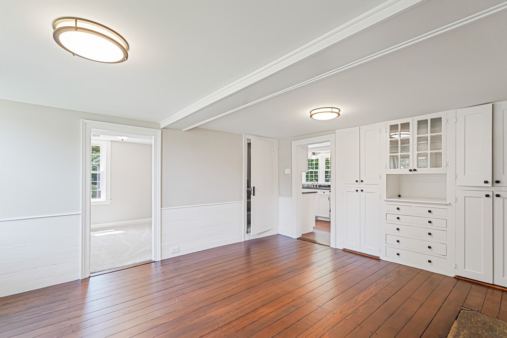 11 Millville Road Mendon, MA 01756 - Photo 9 of 28 an empty room with cabinet and wooden floor