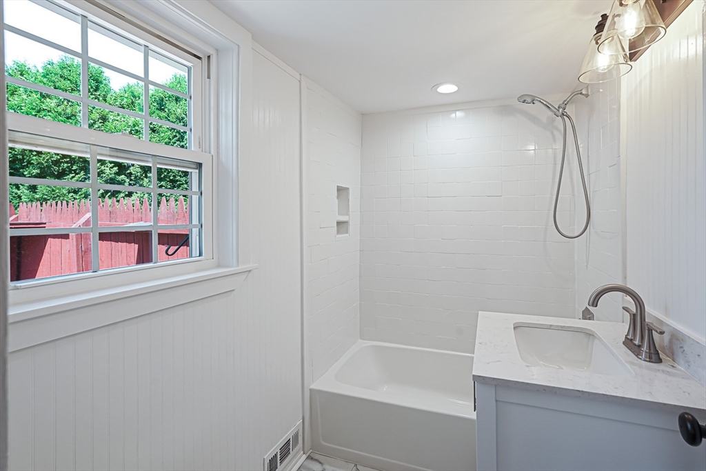 11 Millville Road Mendon, MA 01756 - Photo 10 of 28 a bathroom with a sink a mirror and a bathtub