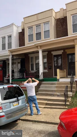 a view of a building with car parked