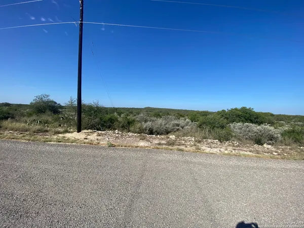 a view of a road with a ocean view