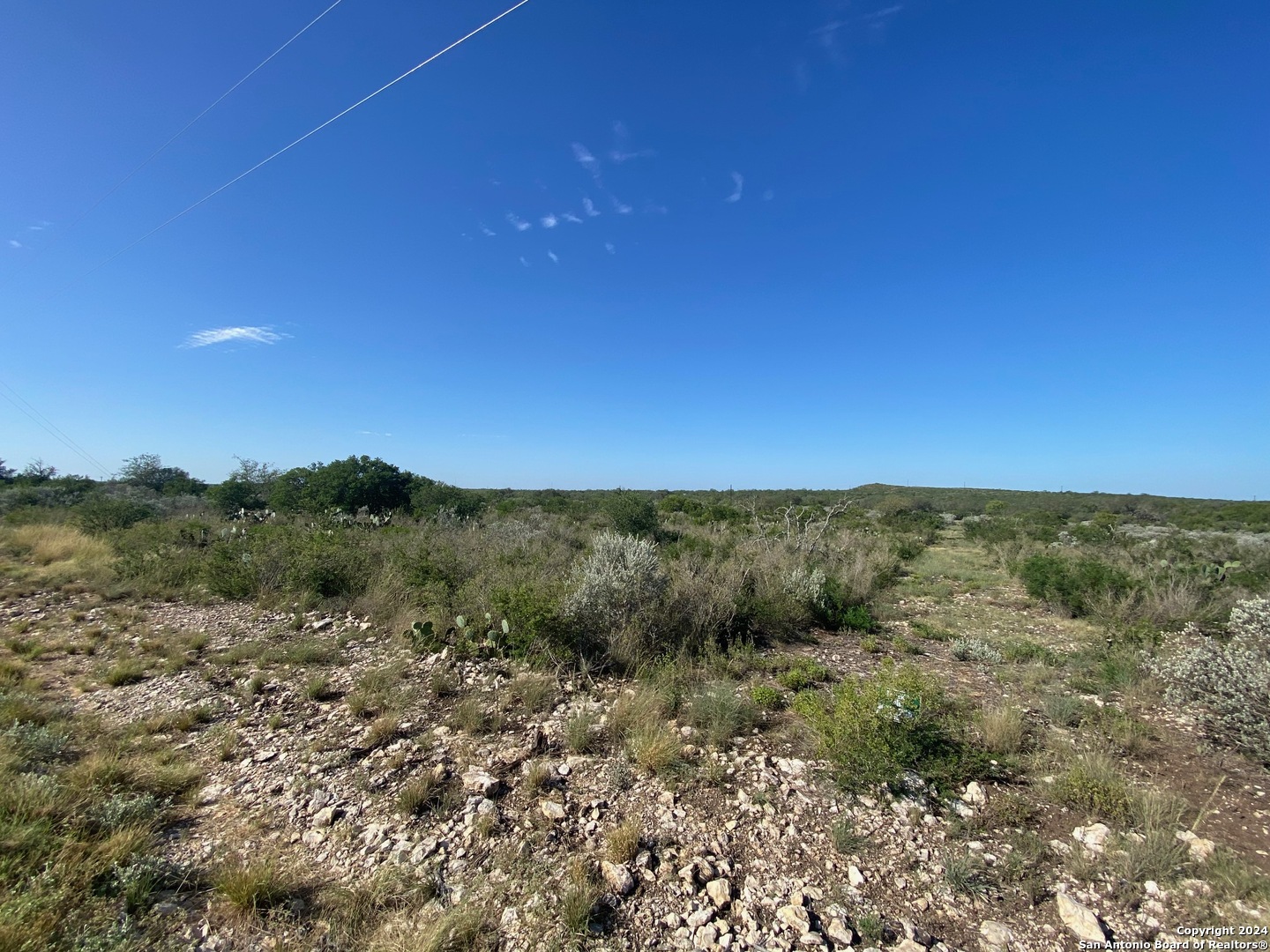 153 Legend Hills Uvalde, TX 78801 - Photo 3 of 8 a view of a field with a mountain in the background