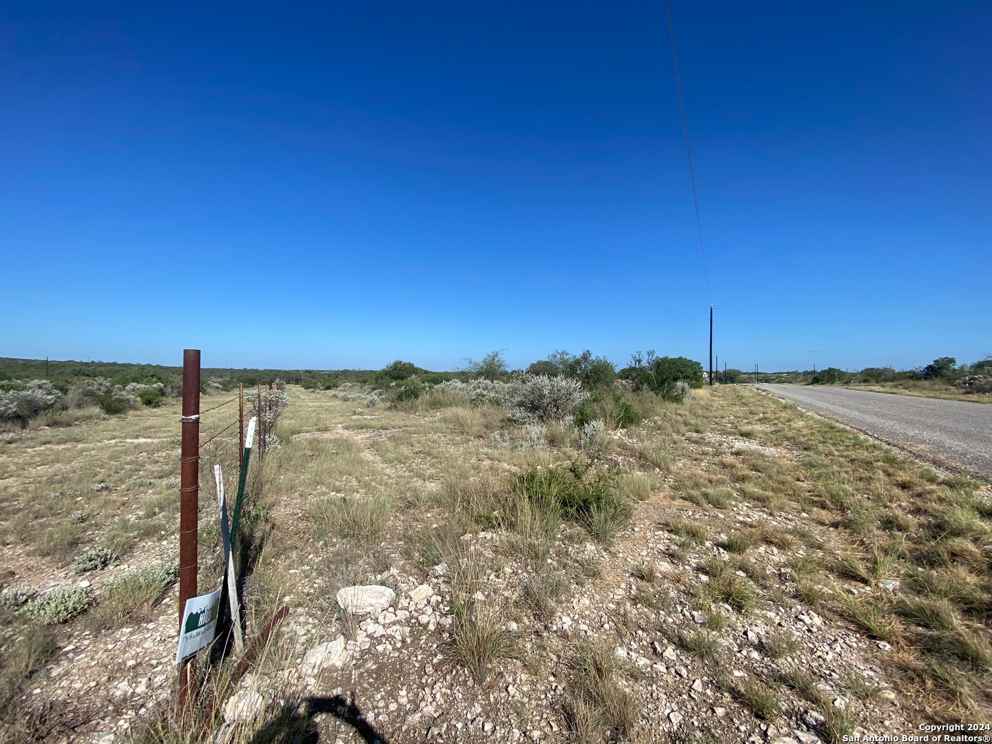 153 Legend Hills Uvalde, TX 78801 - Photo 5 of 8 a view of a large body of water with a building in the background