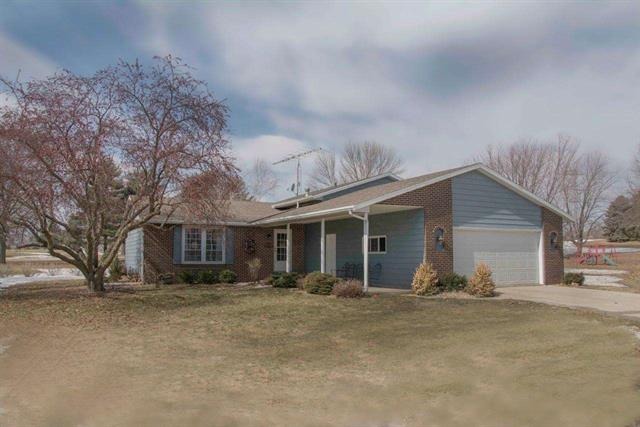 1808 Kelly Road Rock Falls, IL 61071 - Photo 1 of 12 a front view of house with yard and trees around