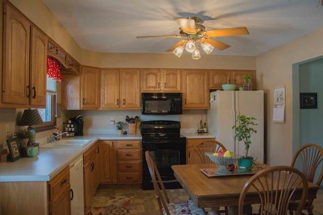 1808 Kelly Road Rock Falls, IL 61071 - Photo 2 of 12 a kitchen with stainless steel appliances granite countertop a stove refrigerator a sink dishwasher with a dining table and chairs