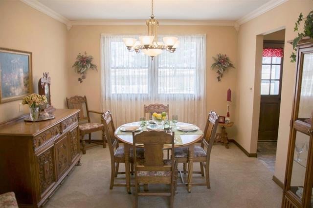 1808 Kelly Road Rock Falls, IL 61071 - Photo 4 of 12 a dining room with furniture a chandelier and window