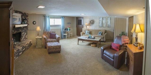 1808 Kelly Road Rock Falls, IL 61071 - Photo 5 of 12 a living room with furniture and a flat screen tv