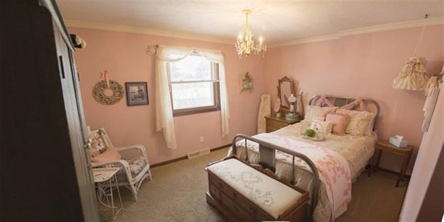 1808 Kelly Road Rock Falls, IL 61071 - Photo 9 of 12 a bedroom with a bed and a window