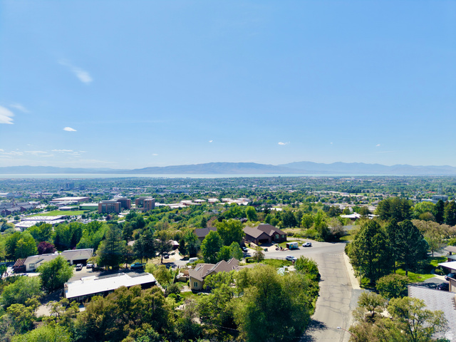 1900 North 100 East Provo, UT 84604 - Photo 44 of 49 Panoramic aerial perspective showcasing a residential landscape with abundant mature trees and distant mountain ranges