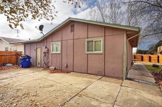 1835 Monterey Road Colorado Springs, CO 80910 - Photo 20 of 22 Rearview with large concrete patio ideal for barbeques