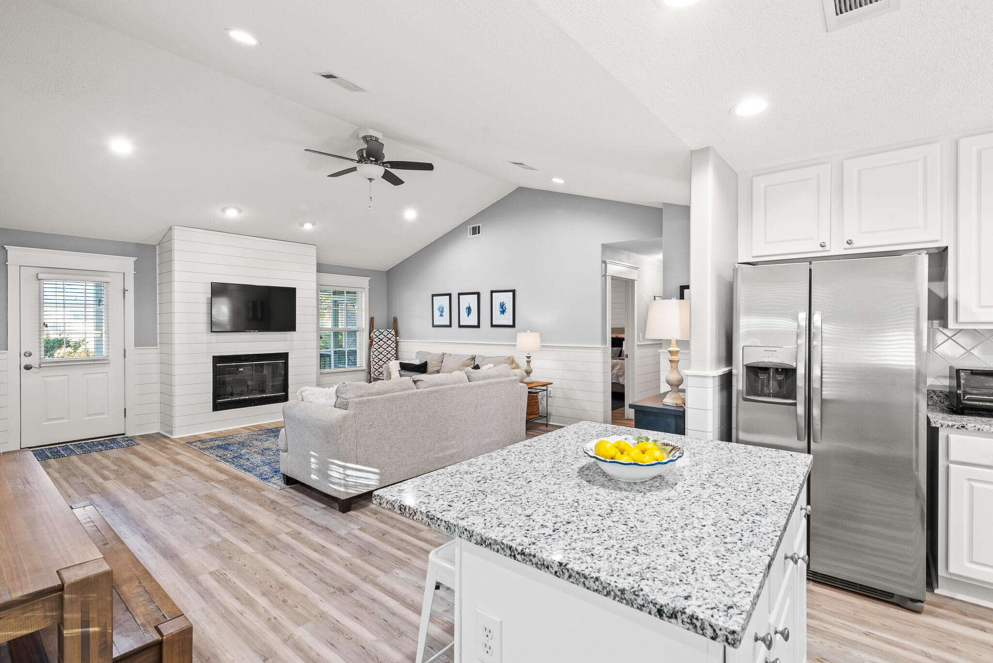 49 Ash Street Santa Rosa Beach, FL 32459 - Photo 12 of 56 a kitchen with stainless steel appliances granite countertop a stove a refrigerator a oven a sink with island cabinets and wooden floor
