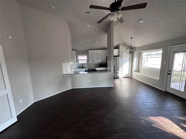 a view of a kitchen with a sink and a window