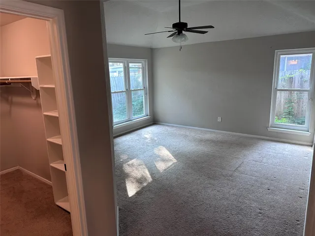 a view of empty room with windows