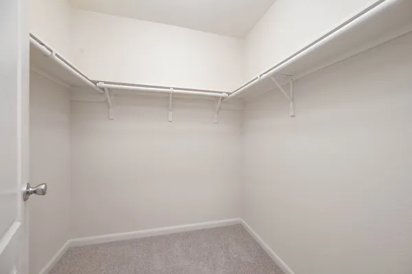 a view of an empty walk in closet