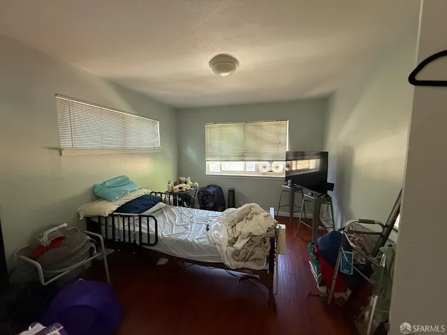 a bedroom with furniture and a window