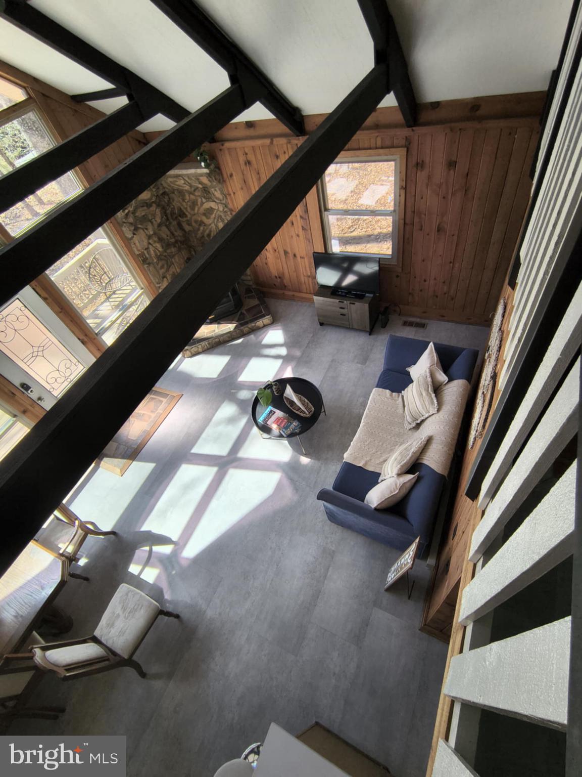 202 Constitution Boulevard Locust Grove, VA 22508 - Photo 11 of 36 a view of entryway with couch and wooden floor