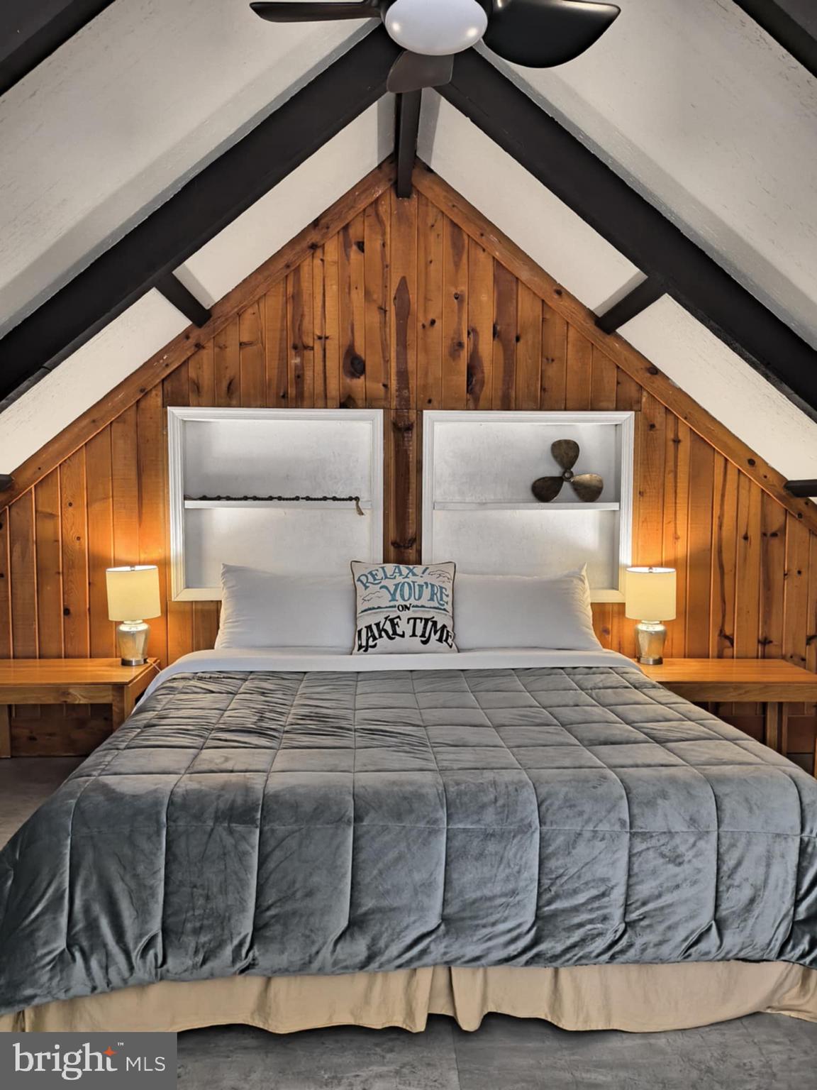 202 Constitution Boulevard Locust Grove, VA 22508 - Photo 13 of 36 a bedroom with a large bed and a window