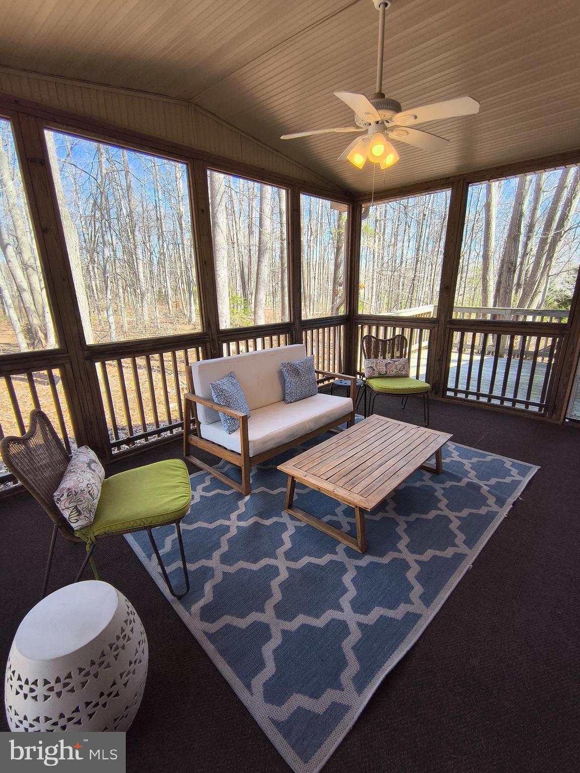 202 Constitution Boulevard Locust Grove, VA 22508 - Photo 15 of 36 a balcony with furniture and a table