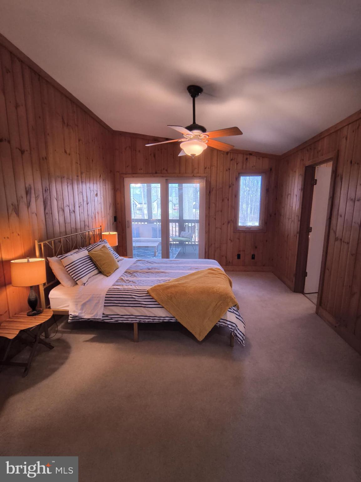 202 Constitution Boulevard Locust Grove, VA 22508 - Photo 17 of 36 a spacious bedroom with a bed and large windows