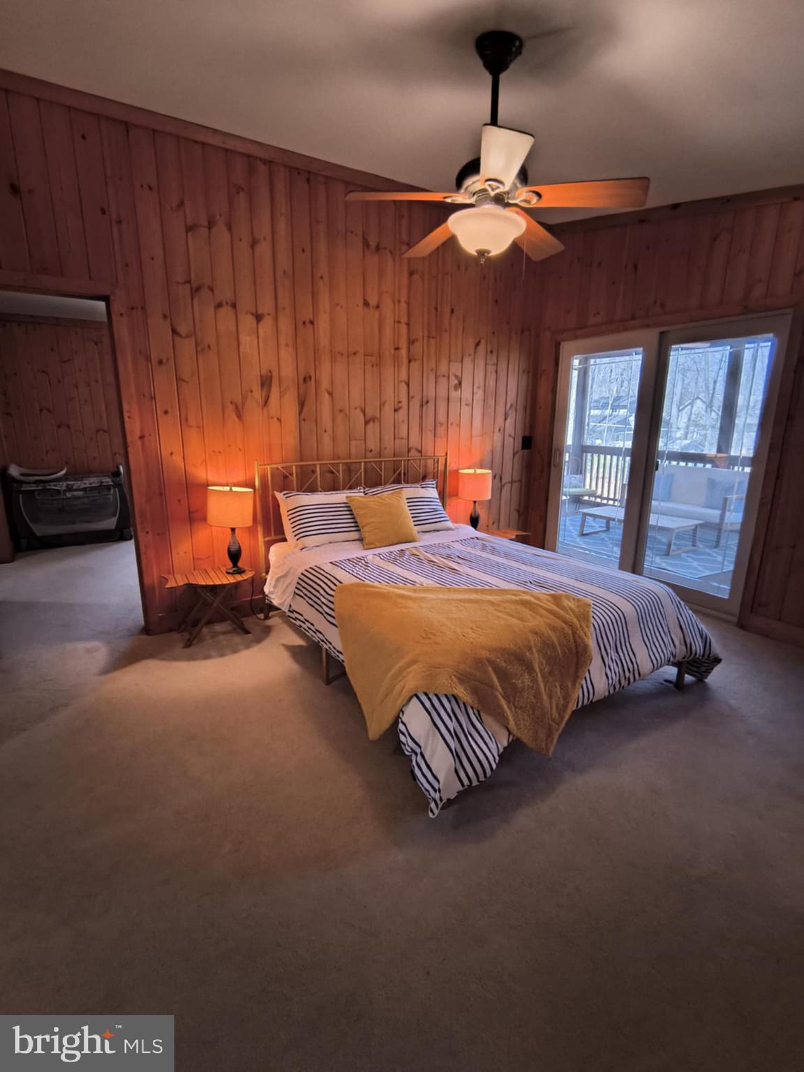202 Constitution Boulevard Locust Grove, VA 22508 - Photo 18 of 36 a bedroom with a bed and a chandelier