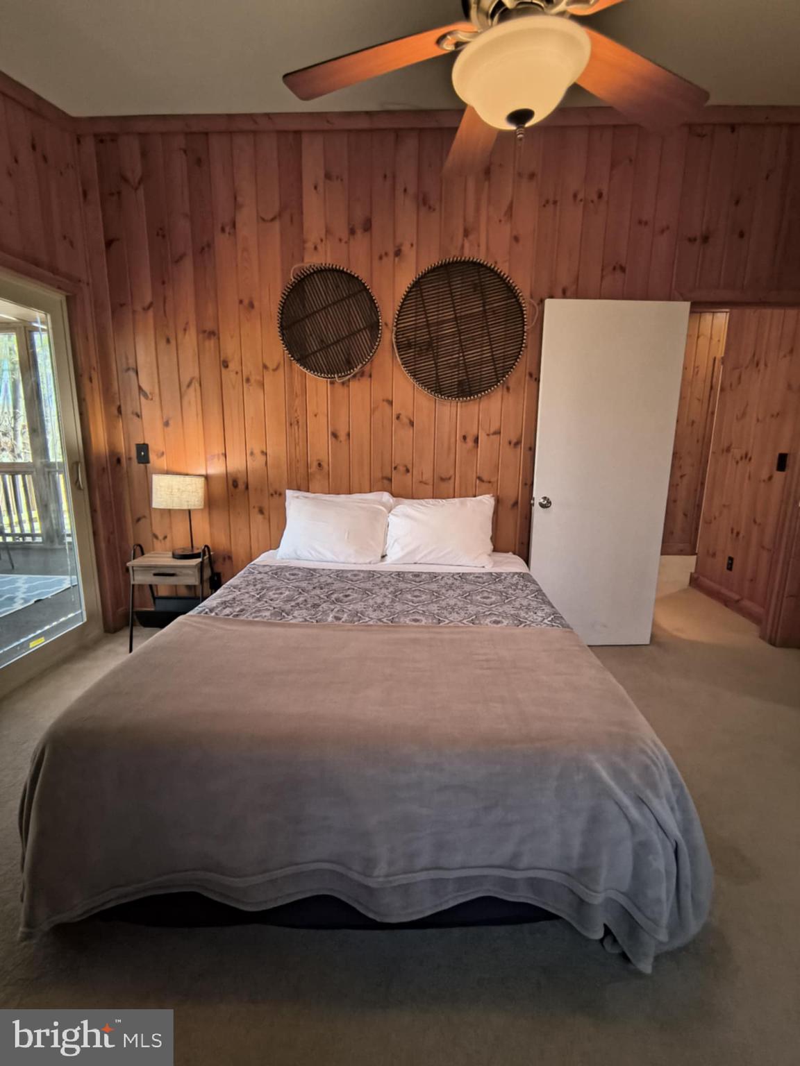 202 Constitution Boulevard Locust Grove, VA 22508 - Photo 19 of 36 a bedroom with a bed and wooden floor