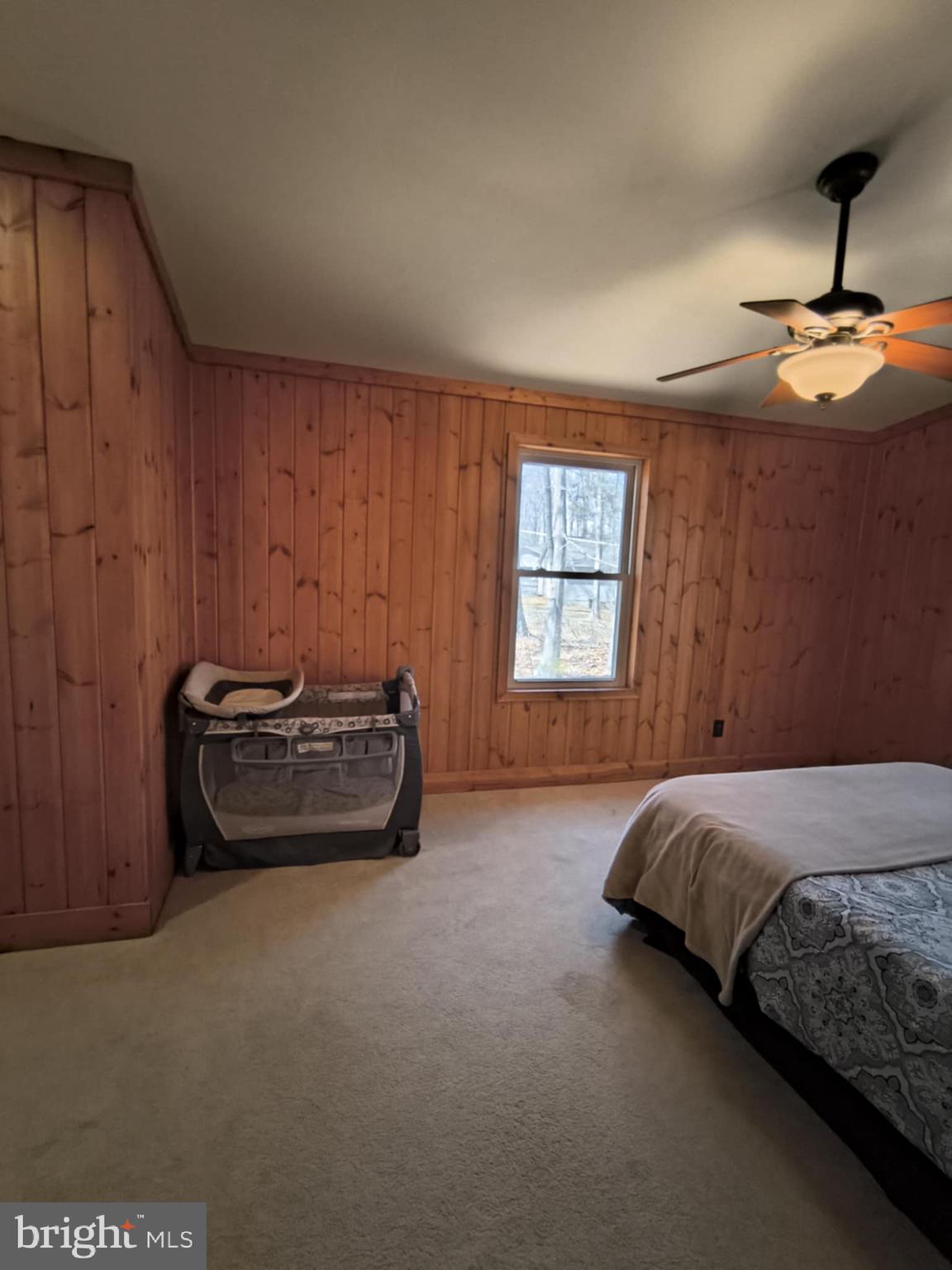 202 Constitution Boulevard Locust Grove, VA 22508 - Photo 23 of 36 a bedroom with a bed and a window
