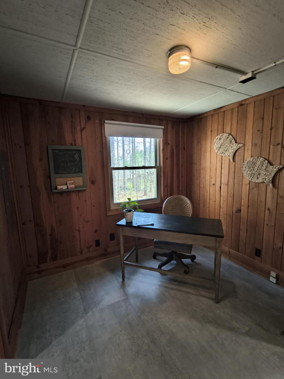 202 Constitution Boulevard Locust Grove, VA 22508 - Photo 24 of 36 a living room with furniture a window and a flat screen tv
