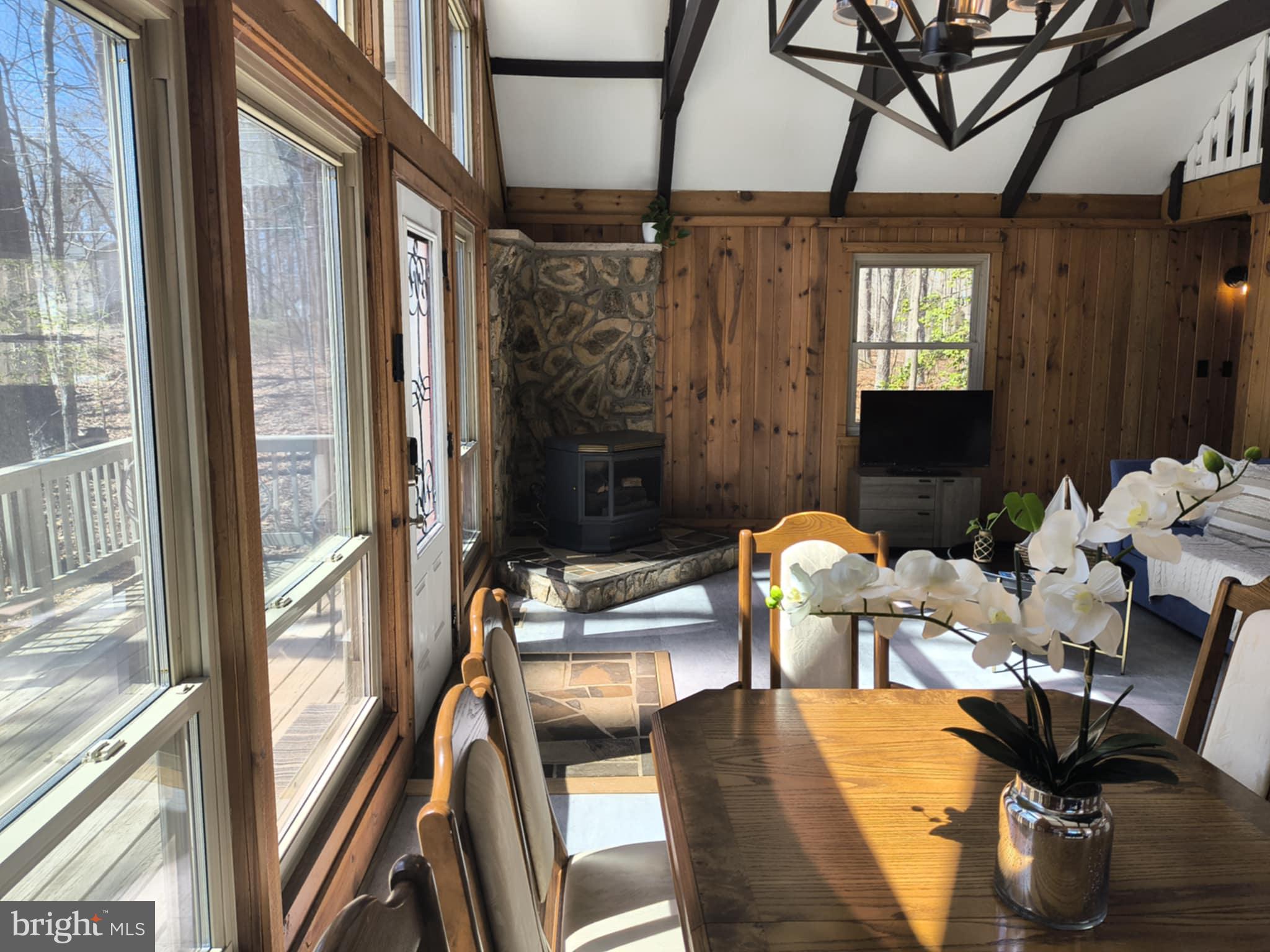 202 Constitution Boulevard Locust Grove, VA 22508 - Photo 4 of 36 a view of a dining room with furniture window and outside view