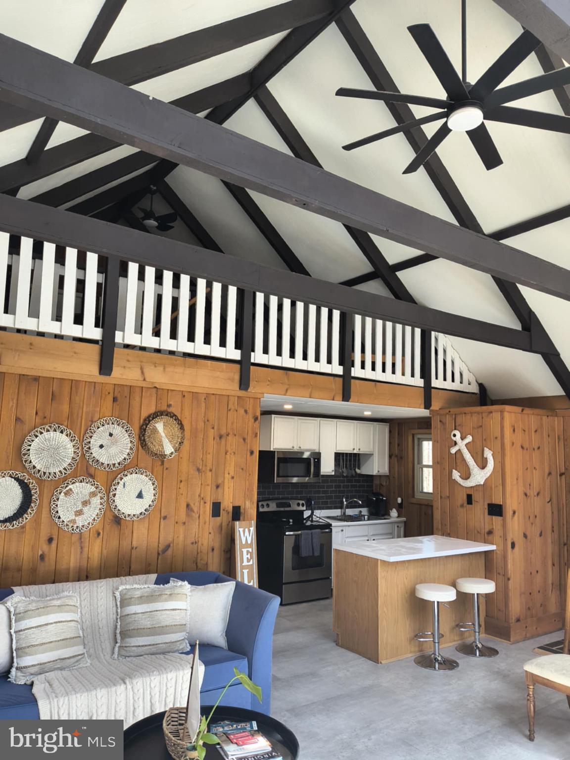 202 Constitution Boulevard Locust Grove, VA 22508 - Photo 6 of 36 a kitchen with a stove a refrigerator and chairs
