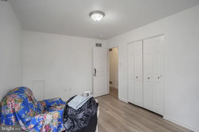 a room that has a bed and a dresser in it