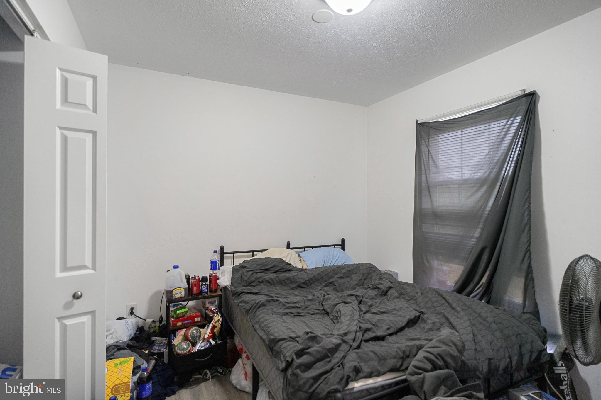 1909 Hanover Pike Hampstead, MD 21074 - Photo 16 of 32 a bedroom with a bed and a window