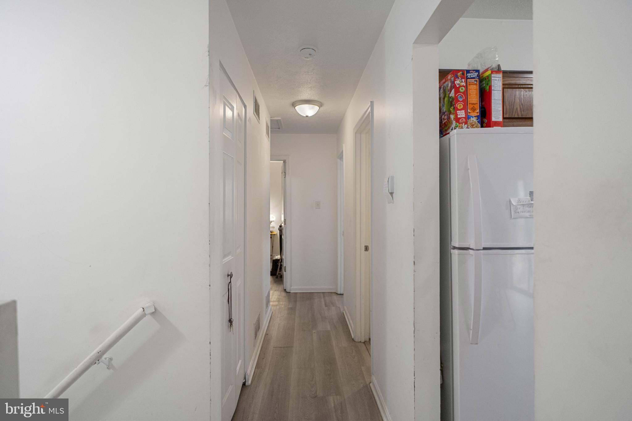 1909 Hanover Pike Hampstead, MD 21074 - Photo 18 of 32 a view of a hallway with wooden floor