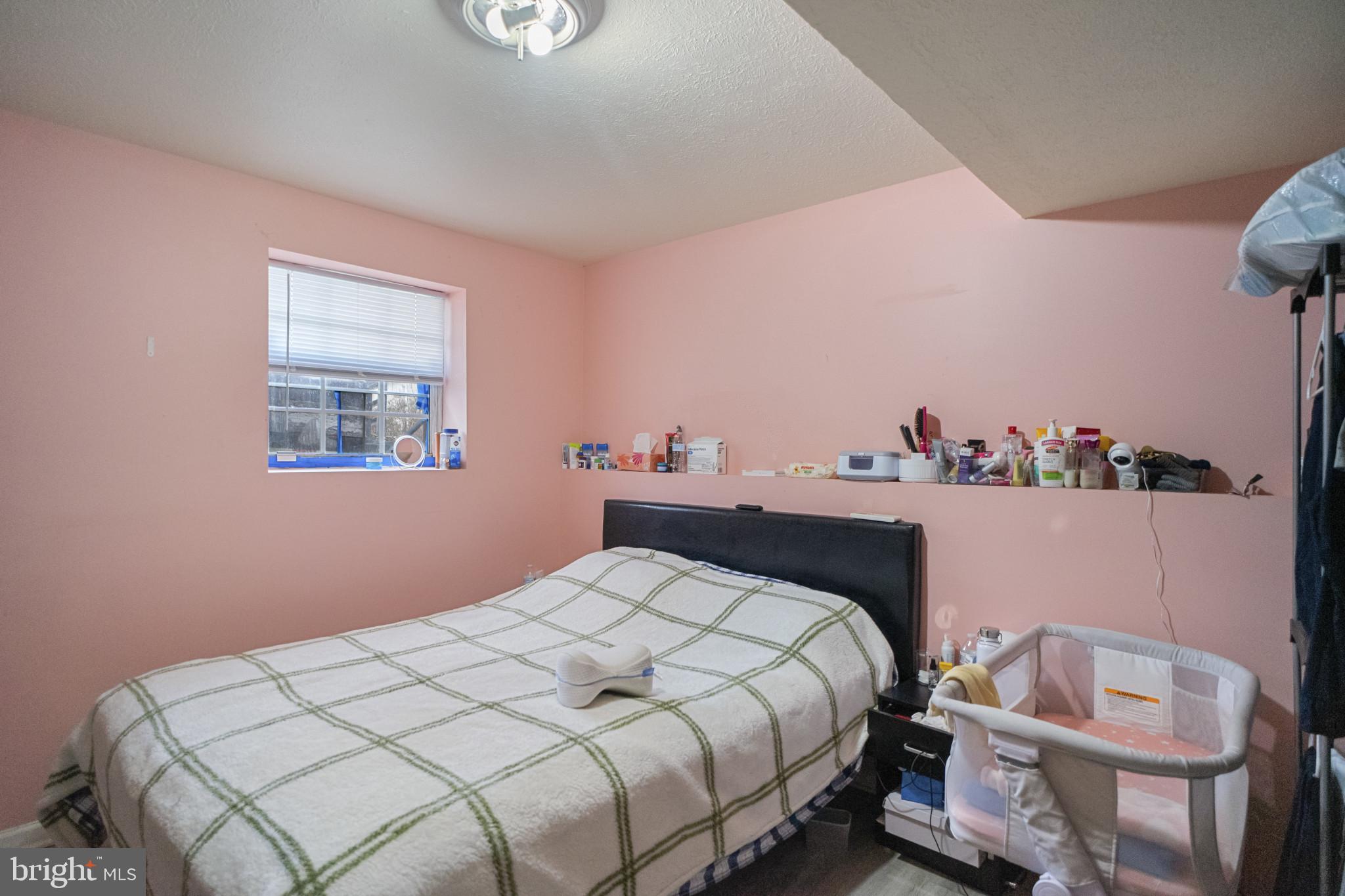 1909 Hanover Pike Hampstead, MD 21074 - Photo 24 of 32 a bedroom with a bed and a window