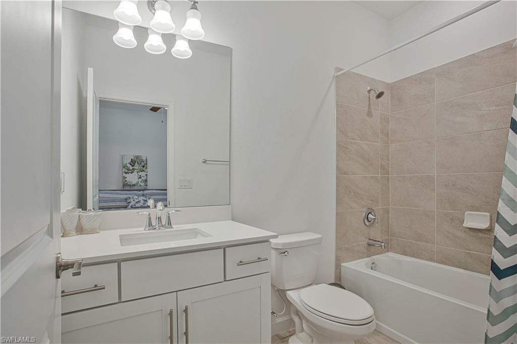 18293 Ridgeline Drive Estero, FL 33928 - Photo 15 of 47 a bathroom with a sink a toilet and shower