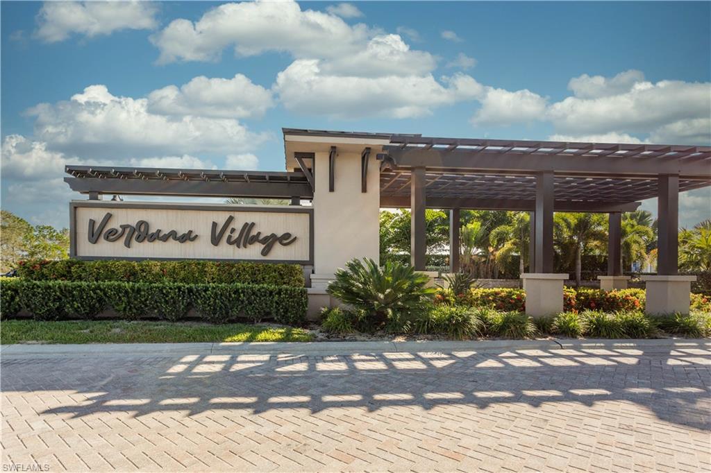 18293 Ridgeline Drive Estero, FL 33928 - Photo 31 of 47 a sign on the side of a building