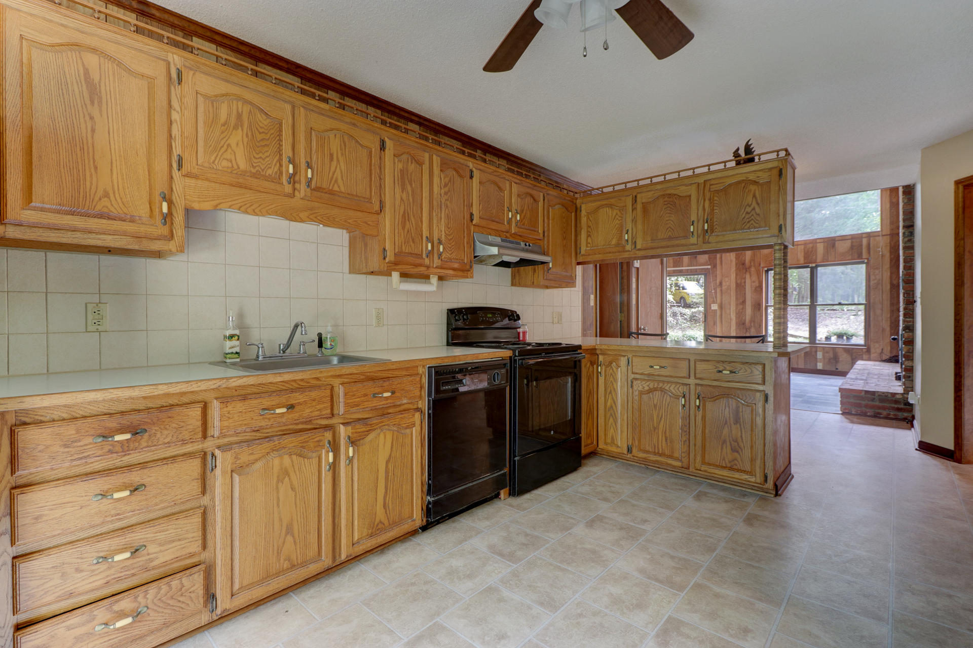 88 Ingram Road Henry, VA 24102 - Photo 12 of 34 a kitchen with granite countertop a sink cabinets stainless steel appliances and a counter space
