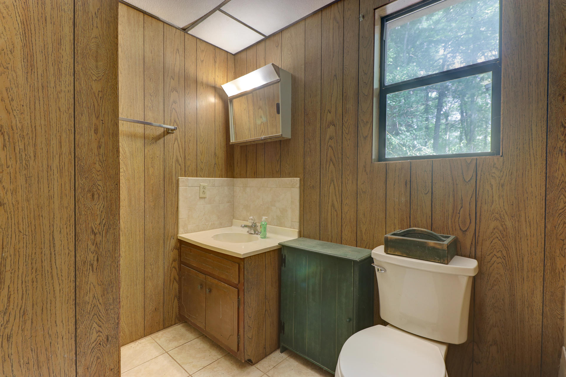 88 Ingram Road Henry, VA 24102 - Photo 31 of 34 a bathroom with a toilet a sink and mirror