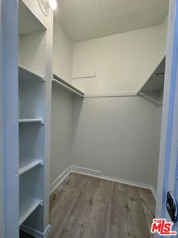 a view of an empty walk in closet