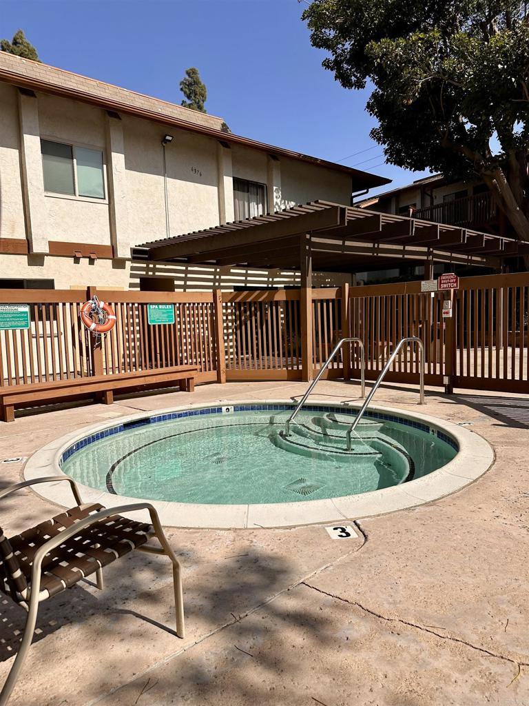 6394 Rancho Mission Road San Diego, CA 92108 - Photo 10 of 14 a backyard of a house with a garden and deck