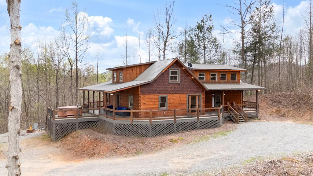 136 A Pack Creek Road Blue Ridge, GA 30513 - Photo 27 of 66 a view of a house with a snow in the yard