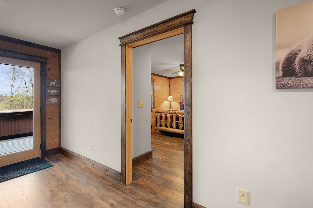 136 A Pack Creek Road Blue Ridge, GA 30513 - Photo 47 of 66 a view of a hallway with wooden floor and a living room