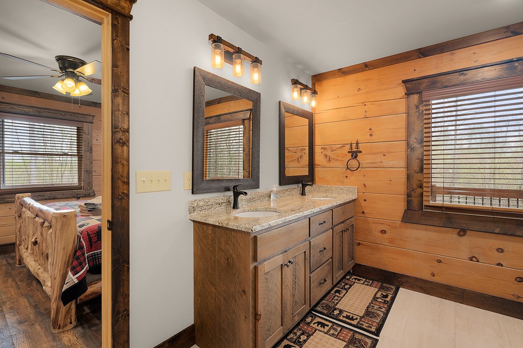 136 A Pack Creek Road Blue Ridge, GA 30513 - Photo 49 of 66 a bathroom with a sink and a mirror